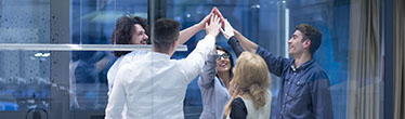Image of group of people "high-fiving"